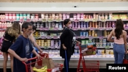FILE PHOTO: People shop in a supermarket as inflation affected consumer prices in Manhattan, New York City
