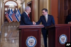 Israeli Prime Minister Benjamin Netanyahu, left, and House Speaker Mike Johnson, R-La., shake hands following their discussions at the Capitol in Washington, Feb. 7, 2025.