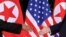 지난 2018년 6월 싱가포르에서 열린 1차 미-북 정상회담에서 도널드 트럼프 미국 대통령(오른쪽)과 김정일 북한 국무위원장이 악수하고 있다.