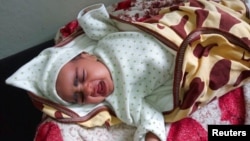 Hemen Hagos, 1.5 months old Ethiopian child admitted with pertussis, also known as whooping cough, receives care at a hospital in Mekelle, the capital of Tigray region, Ethiopia September 9, 2022. (REUTERS/Stringer)