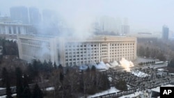 Smoke rises from the city hall building during a protest in Almaty, Kazakhstan, Jan. 5, 2022.