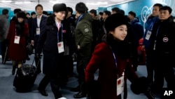 Members of the North Korean Olympic delegation arrive at the Olympic Village of the 2018 Winter Olympics in Gangneung, South Korea, Feb. 1, 2018. (AP Photo/Charlie Riedel)