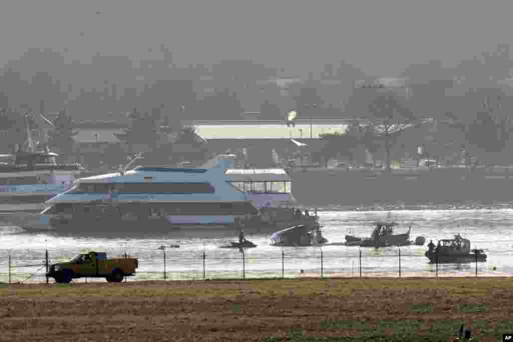 Search and rescue efforts are seen around a wreckage site in the Potomac River from Ronald Reagan Washington National Airport, Jan. 30, 2025, in Arlington.