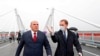 FILE - Russian Prime Minister Mikhail Mishustin, left, and Minister for the development of the Far East and Arctic Alexander Kozlov visit the bridge across the Amur River on the border between Russia and China in the city of Blagoveshchensk, Russia, Aug. 17, 2020. 