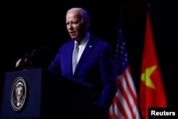 ปธน.โจ ไบเดน ขึ้นแถลงข่าวที่กรุงฮานอย เมื่อวันที่ 10 ก.ย. 2023 (REUTERS)