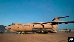 An Indian Air Force aircraft with earthquake relief consignment lands in Kabul, Afghanistan, June 23, 2022. India said it sent a technical team to coordinate the delivery of humanitarian assistance after a powerful earthquake. (India's Ministry of External Affairs via AP)