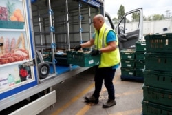 FILE - Czaban, 36-year-old, also known as DJ Revolution works as a food delivery truck driver for a supermaket chain during the global coronavirus disease (COVID-19) outbreak, in Budapest