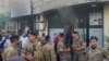 Lebanese soldiers gather outside a damaged mobile shop after what is believed to be the result of a walkie-talkie exploding inside it, in the southern port city of Sidon, Lebanon, Sept. 18, 2024.
