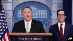 Secretary of State Mike Pompeo and Treasury Secretary Steve Mnuchin brief reporters about additional sanctions placed on Iran, at the White House, Jan. 10, 2019, in Washington. 