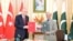 Turkish President Recep Tayyip Erdogan, left, and Pakistani Prime Minister Shahbaz Sharif hold copies of a joint declaration at the Pakistan-Turkey High Level Strategic Cooperation Council in Islamabad, Feb. 13, 2025. (Ministry of Information and Broadcasting, Pakistan)