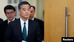FILE - Hong Kong Chief Executive Leung Chun-ying arrives at a news conference.