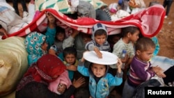 په‌ناخوازانی کورد له‌ سه‌ر سنووری سوریا له‌ نیو تورکیا خه‌لکی کۆبانی، 2ی ئوکتۆبری 2014