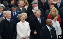 Former President George W. Bush, right, his wife Laura, Former Secretary of State Hillary Clinton and Former President Bill Clinton wait for the 58th Presidential Inauguration for Donald Trump at the U.S. Capitol.