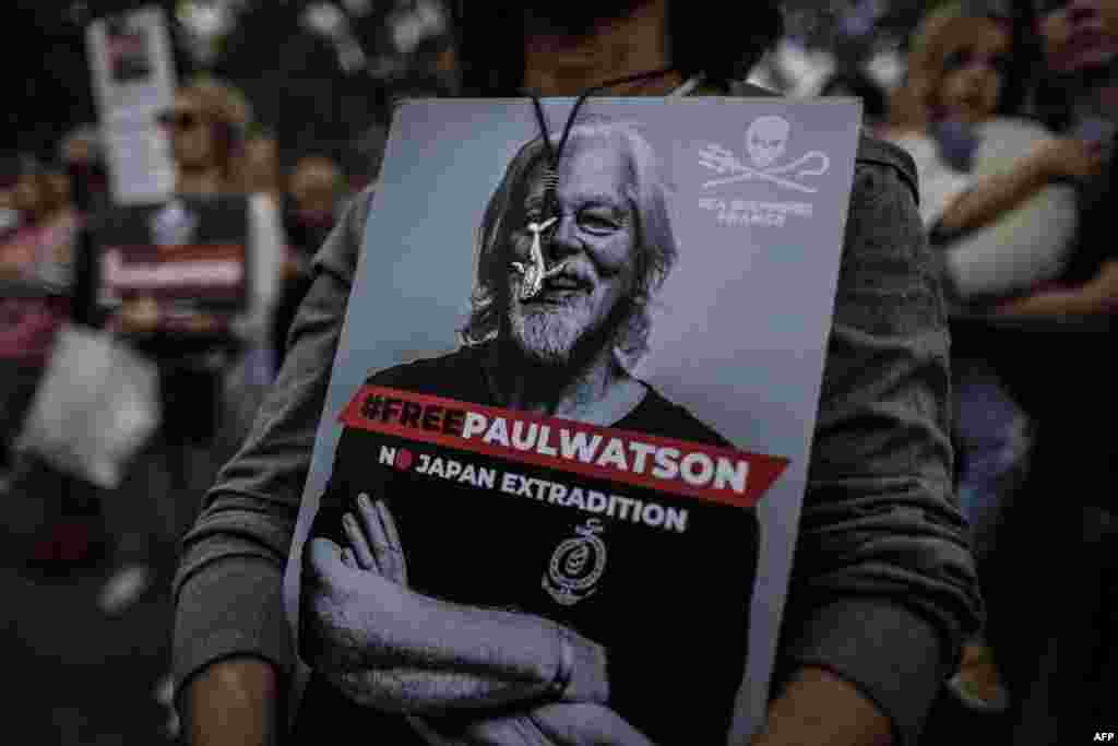 A protester holds a sign displaying the portrait of the NGO Sea Shepherd Canadian founder Paul Watson during a demonstration in his support in Paris, France. Watson was arrested on July 21, 2024 in Greenland under an Interpol 'red notice' issued by Japan. A court hearing on his continued detention was due on Sept. 4.