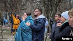 Одесити сподіваються на порятунок людей, які досі не виходять на зв'язок після російської атаки дронами. Одеса, 2 березня 2024 року. REUTERS/Stringer