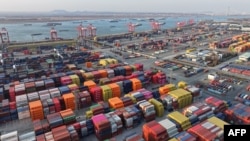 An aerial view shows containers at the port in Nanjing, in China's eastern Jiangsu province, Feb. 4, 2025. China said it would impose tariffs on imports of US energy, vehicles and equipment, 