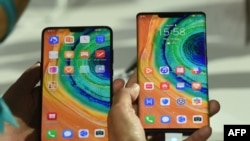 The Mate 30 Pro, the latest smartphone by the Chinese tech giant Huawei, is displayed after a presentation to reveal the Mate 30 and Mate 30 Pro in Munich, Germany, Sept. 19, 2019.