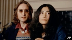 John Lennon and his wife Yoko Ono speak at a press conference, March 2, 1973, in New York. (AP Photo)