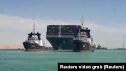 Egypt, Suez Canal, Ship Ever Given, one of the world's largest container ships, is seen after it was fully floated