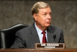 FILE - Senate Judiciary Committee Chairman Lindsey Graham of South Carolina prepares to hear testimony in the Dirksen Senate Office Building in Washington, June 3, 2020.