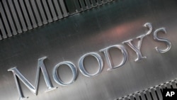 FILE - This August 2010 file photo shows a sign for Moody's Corp. in New York. Moody's is expected to report financial earnings Friday, Oct. 21, 2016. (AP Photo/Mark Lennihan, File)