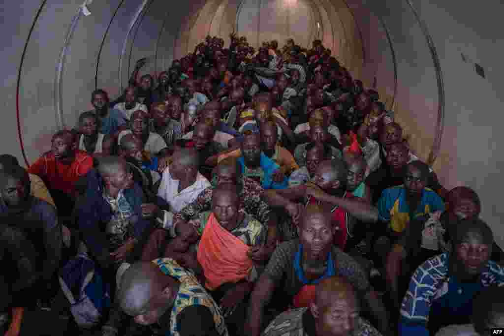 Hundreds of volunteers sit on a plane bound for a training center after answering Democratic Republic of Congo's President Felix Tshisekedi's call to join the army to go to the front lines to fight against the M23 rebellion in Goma, Nov. 14, 2022.