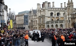 The funeral cortege arrives at Great St. Mary's Church for the funeral of theoretical physicist Stephen Hawking, in Cambridge, Britain, March 31, 2018.