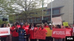 Protesters take part in a march to demand efforts increase to find kidnapped girls in Nigeria, in front of the Nigerian embassy in Washington, May 6, 2014. (Chelsea Pescador/VOA)