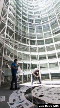 This towering glass facade is part of the renovation work, which seeks to combine new with old.