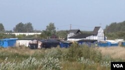 The 'Jungle' migrant camp, seen here, is due to be completely demolished by year's end, in Calais, France. (L. Bryant/VOA)