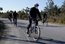 President-elect Joe Biden rides a bike at Cape Henlopen State Park on Saturday, Nov. 14, 2020, in Lewes, Del. (AP Photo/Alex Brandon)