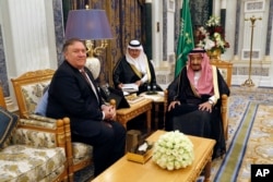 FILE - U.S. Secretary of State Mike Pompeo, left, meets with Saudi Arabia's King Salman in Riyadh, Saudi Arabia, Oct. 16, 2018.