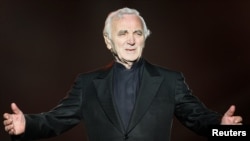 FILE - French singer Charles Aznavour performs during the Quebec Summer Festival, July 6, 2008. 