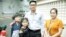 FILE - Former Radio Free Asia reporters Yeang Sothearin and his family pose for picture outside Phnom Penh Municipal Court Friday, August 30, 2019. (Tum Malis/VOA Khmer)