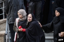 Palestinian women react outside a hospital following an Israeli airstrike in the Nuseirat camp in the central Gaza Strip on Nov. 28, 2024.