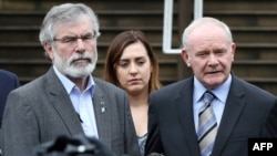 Sinn Fein leader Gerry Adams (L) and Sinn Fein politician and Northern Ireland's Deputy First Minister, Martin Mcguinness (R) speak during a press conference outside Stormont Castle in Belfast, Northern Ireland on June 24, 2016, following the result of the United Kingdom's June 23 referendum on whether or not to leave, or remain in the European Union (EU).