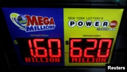 Signs display the jackpots for Tuesday's Mega Millions and Wednesday's Powerball lottery drawings in New York City, U.S., October 22, 2018. (REUTERS/Brendan McDermid )