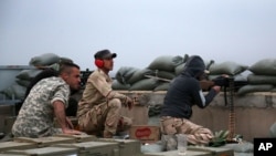 شه‌ڕی هێزه‌کانی ئاسایشی عێڕاق له‌ گه‌ڵ داعش له‌ نزیک تکریت، 12ی مارسی 2015.