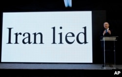 Israeli Prime Minister Benjamin Netanyahu presents material on Iranian nuclear weapons development during a press conference in Tel Aviv, April 30, 2018.