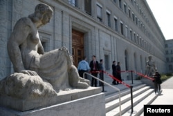 FILE - People are pictured in the headquarters of the World Trade Organization (WTO) in Geneva, Switzerland, April 12, 2017.