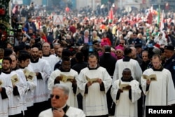 Clergymen attend Christmas celebrations at Manger Square outside the Church of the Nativity in Bethlehem, in the Israeli-occupied West Bank, Dec. 24, 2018.