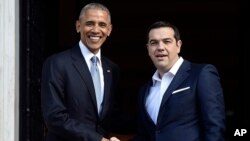 ፕሬዚዳንት ባራክ ኦባማ እና የግሪክ ጠቅላይ ሚኒስትሩ አሌክሲስ ሲፕራስ