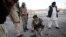 Paramilitary soldiers survey a bomb attack site in Quetta December 10, 2012. At least one person was killed and two injured on Monday when an explosion hit Quetta, capital of Pakistan's restive Balochistan province, local media reported. REUTERS/Naseer A