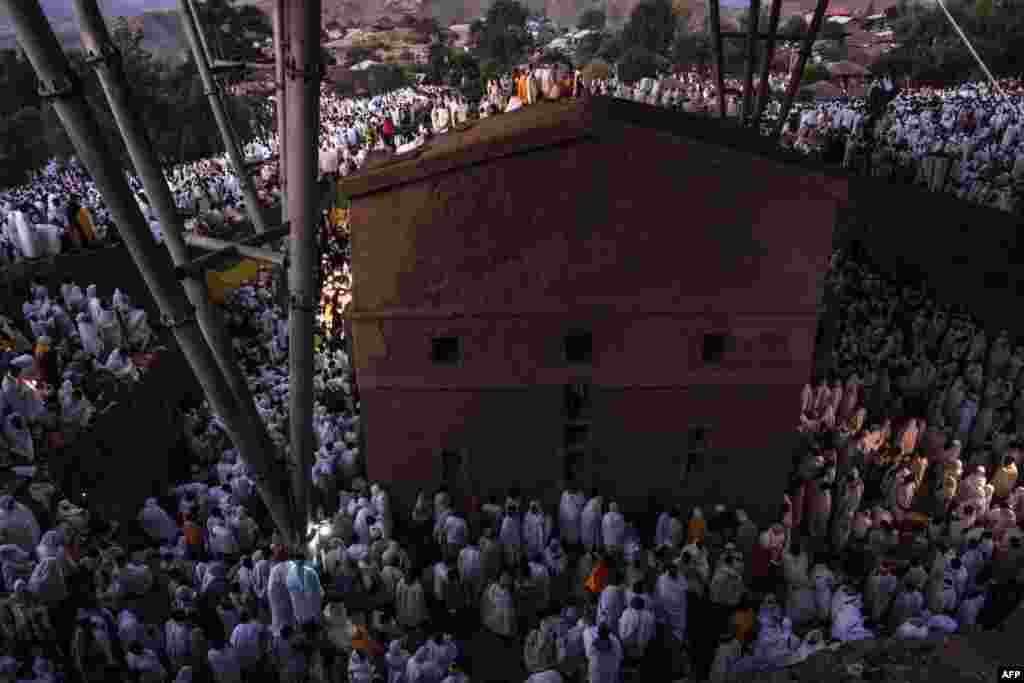 Pilgrims attend the celebration of Genna, the Ethiopian Orthodox Christmas, at Saint Mary's Church, in Lalibela, 645 kilometres (400 miles) north of Addis Ababa, in the Amhara region bordering the northern region of Tigray.