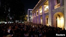 FILE - Hundreds of members from the legal sector stage a silent protest outside the Court of Final Appeal, against Beijing's most direct intervention in Hong Kong's legal and political system since the 1997 handover, in Hong Kong, China, Nov. 8, 2016.