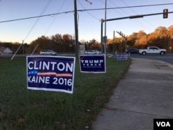 Banners supporting presidential candidates for the US Presidential election 2016 are placed outside one pooling station in Prince William County, Virginia, on Tuesday morning, November 8, 2016. (Poch Reasey/VOA Khmer)