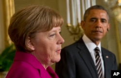 President Barack Obama and German Chancellor Angela Merkel participate in a joint news conference in the East Room of the White House in Washington, Feb. 9, 2015.