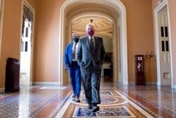 Senate Majority Leader Mitch McConnell walks off the Senate floor on Capitol Hill in Washington, July 29, 2020.