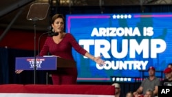 FILE - Kari Lake, then an Arizona Republican Senate candidate, speaks during a campaign event in Glendale, Arizona, on July 31, 2024. President-elect Donald Trump announced on Dec. 11, 2024, that Lake is his choice to lead the government-funded broadcaster Voice of America.