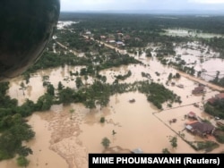 file - Aerial view shows the flooded area after a dam collapsed in Attapeu province, Laos, July 25, 2018, in this image from social media.